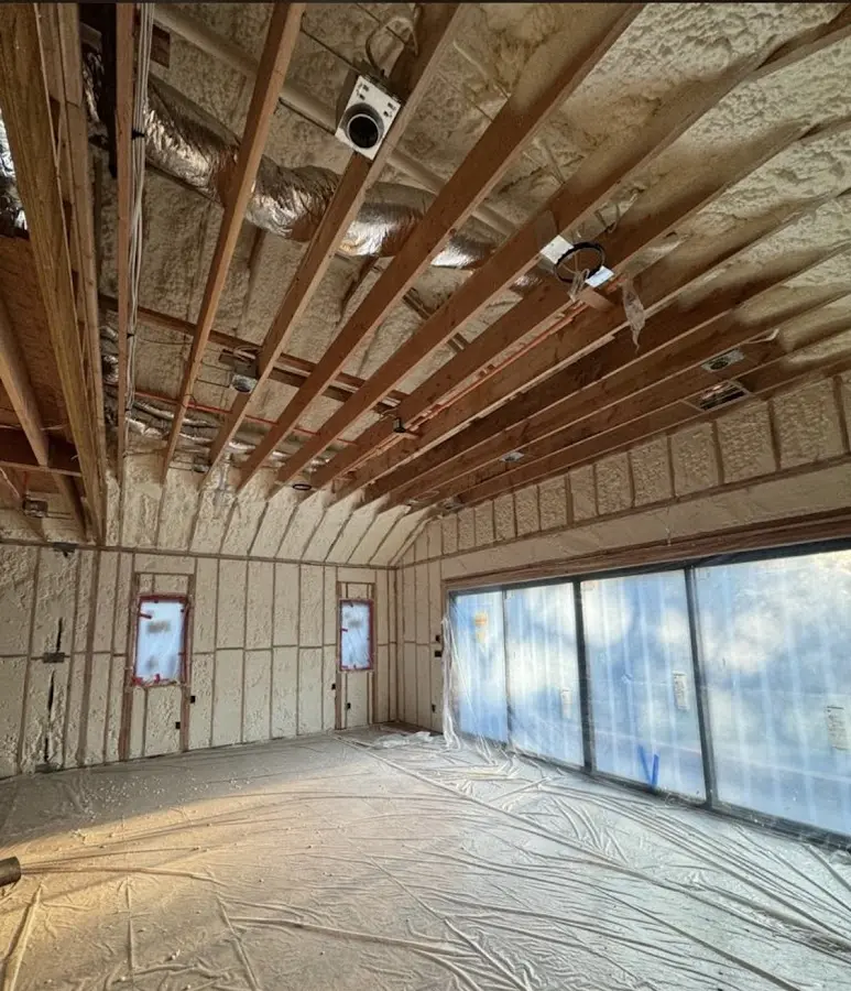 Interior walls and ceiling insulated with spray foam during new construction in Chanute
